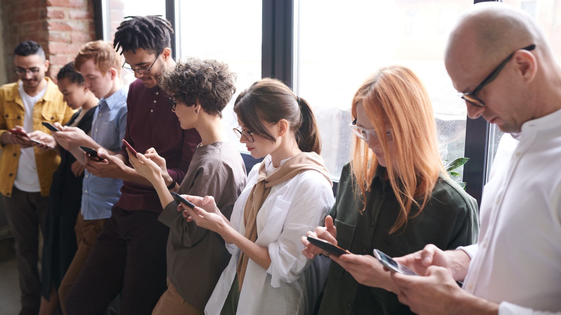 people on phone using freemium service