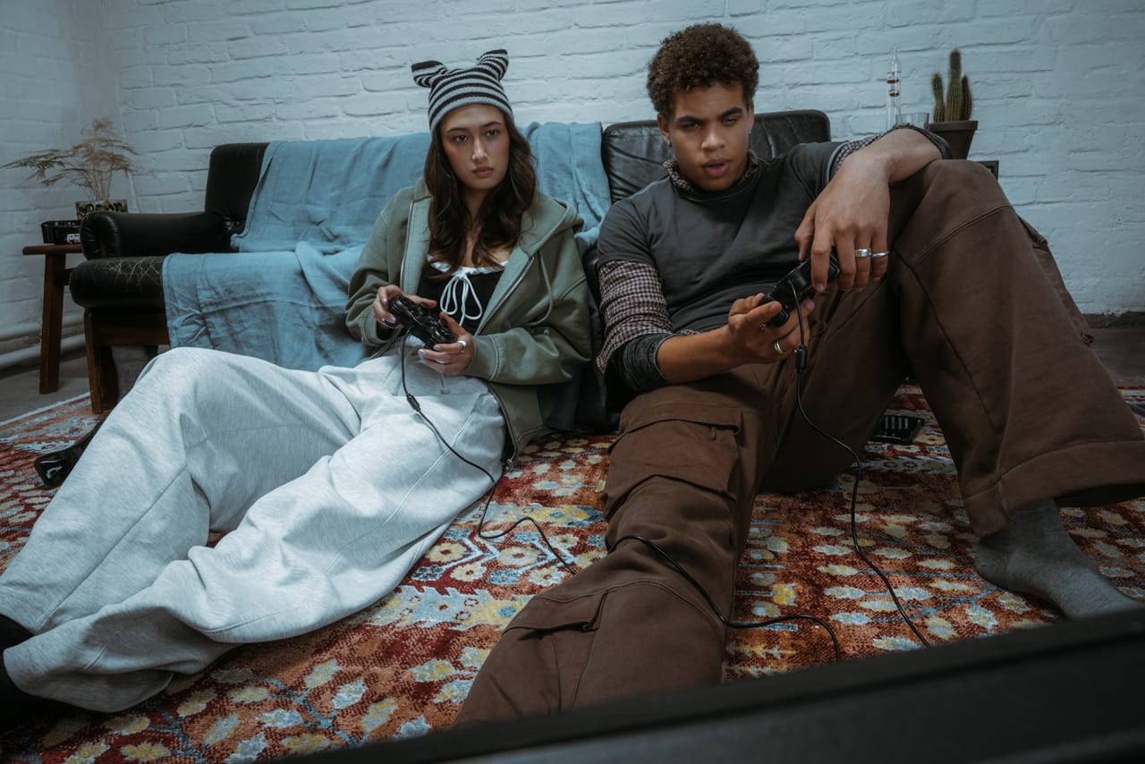 two people playing a playstation game