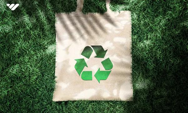 Canvas tote bag with a recycling icon